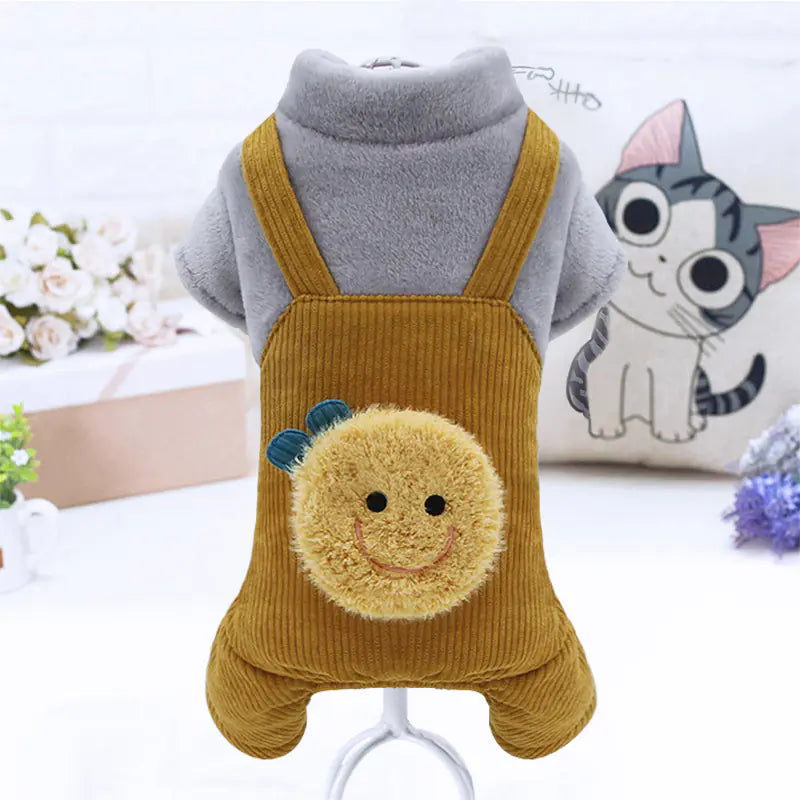 Pet outfit with mustard yellow overalls featuring a smiley face design on a white background.