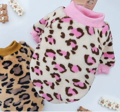 Leopard print sweater with pink collar on a white background
