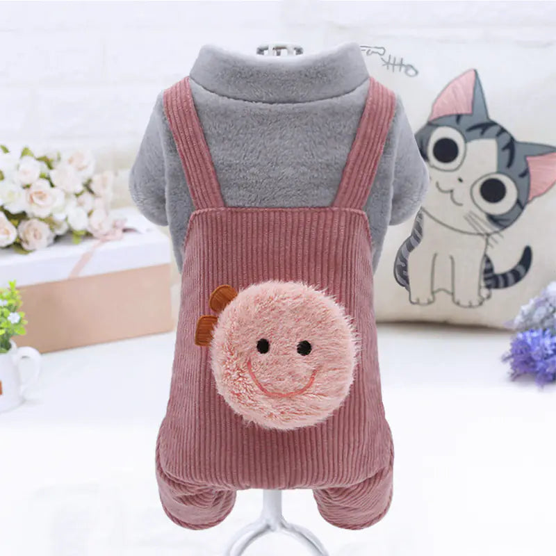 Pet outfit with pink smiley face design on a white background