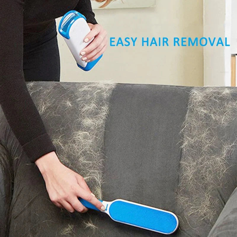 Person using a blue and white hair removal tool on a gray sofa with visible hair.